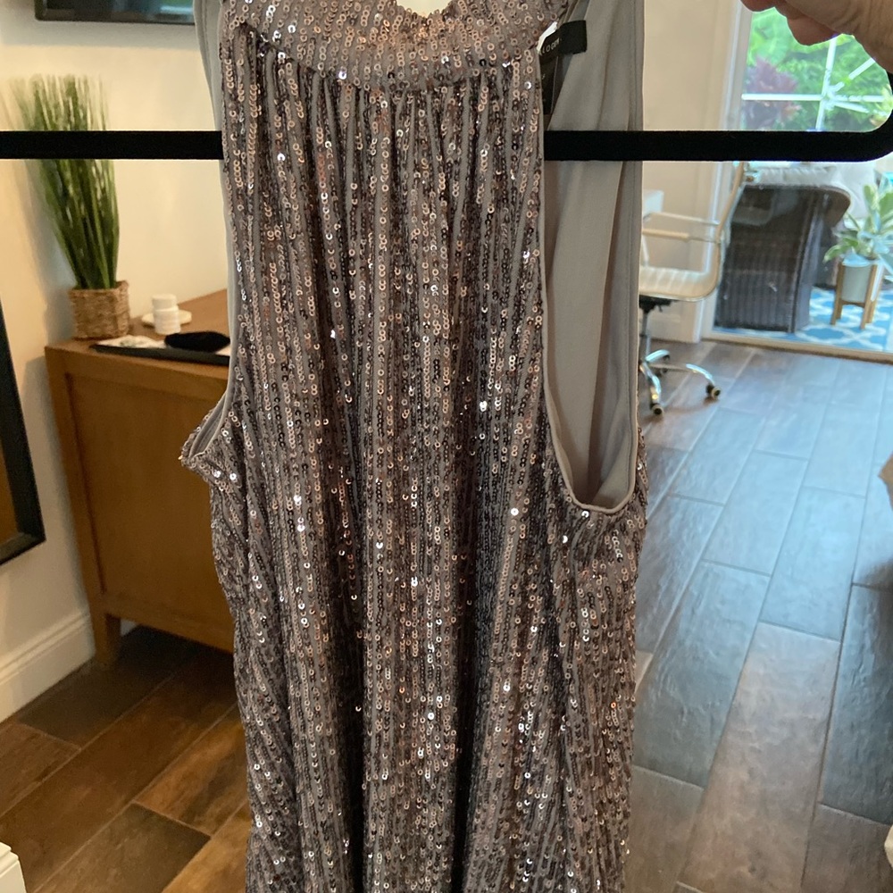 Sequin silver sleeveless blouse. Very pretty for any event or holiday